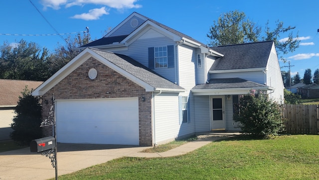 front of property featuring a front lawn and a garage