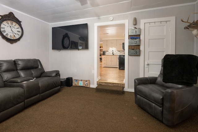 living room with crown molding and dark carpet