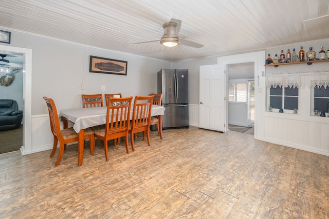 dining space featuring hardwood / wood-style flooring and ceiling fan