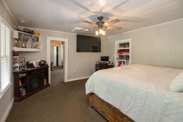 carpeted bedroom featuring ceiling fan, crown molding, and multiple windows