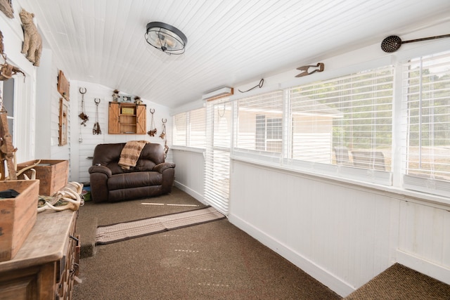 sunroom featuring vaulted ceiling and plenty of natural light