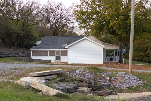 view of front of house with a sunroom