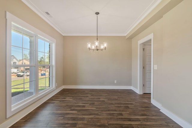 unfurnished dining area with dark wood finished floors, a chandelier, ornamental molding, and a healthy amount of sunlight