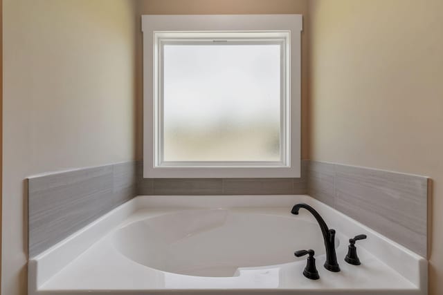 full bath with a garden tub