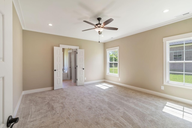 unfurnished bedroom featuring carpet floors, crown molding, visible vents, and baseboards