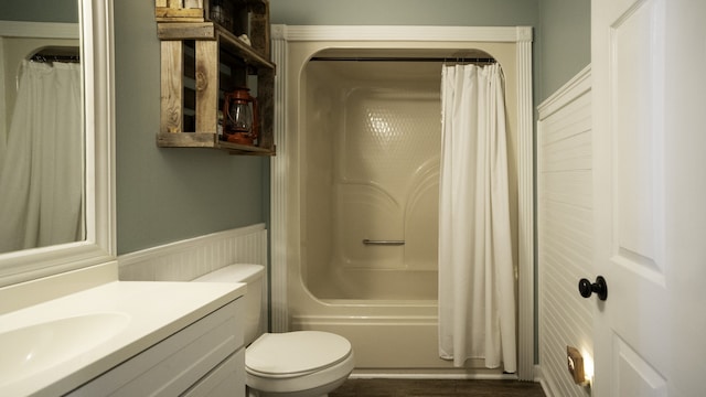 full bathroom with vanity, hardwood / wood-style floors, shower / tub combo with curtain, and toilet