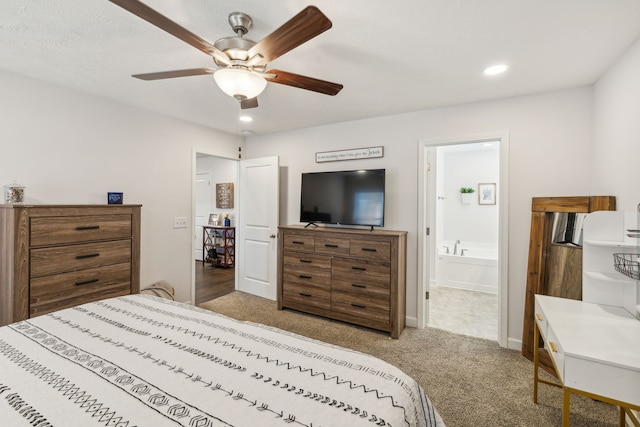 carpeted bedroom featuring ensuite bathroom and ceiling fan