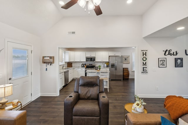 living room with sink, ceiling fan, high vaulted ceiling, and dark hardwood / wood-style flooring