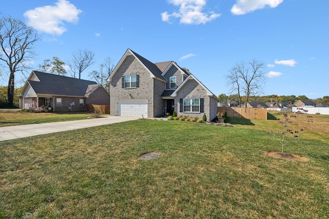 view of front of property featuring a front lawn and a garage