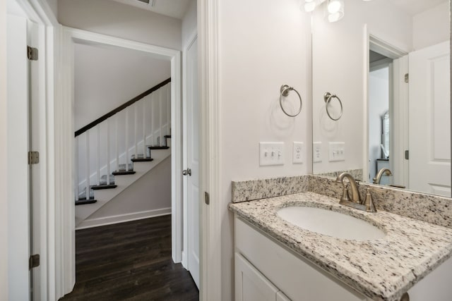 bathroom with vanity and wood-type flooring