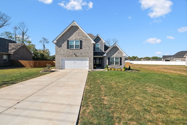 view of front facade with a front yard and a garage