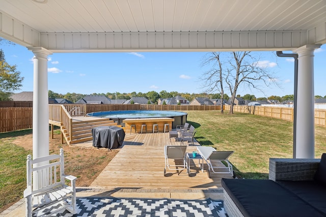 wooden deck featuring a yard