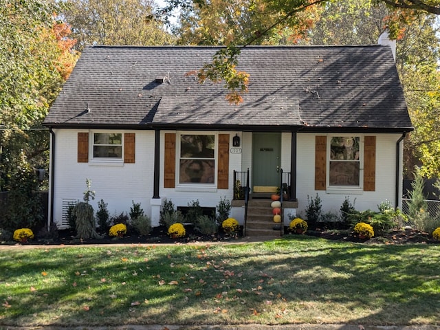 ranch-style house featuring a front lawn