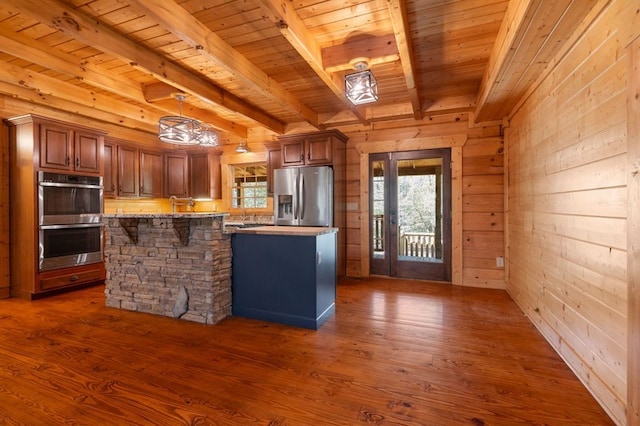 kitchen featuring wood ceiling, stainless steel appliances, and dark hardwood / wood-style flooring