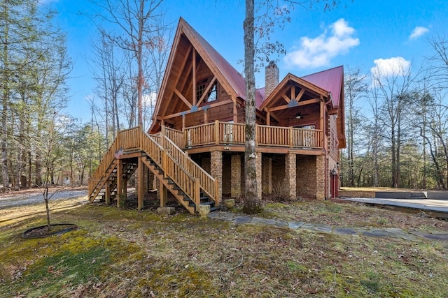 rear view of property with a deck