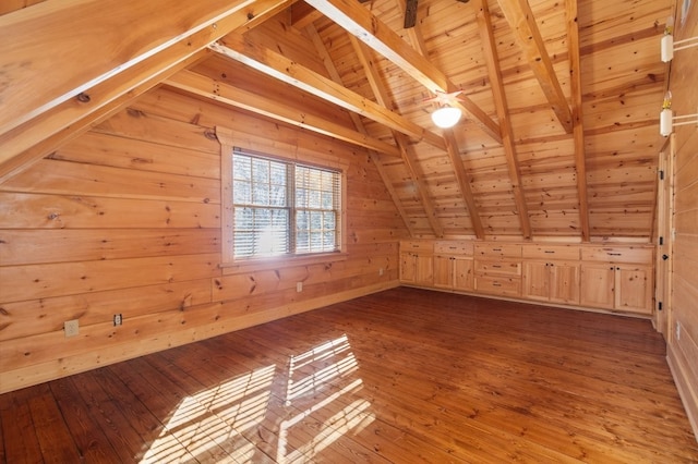 bonus room with wood ceiling, wood walls, hardwood / wood-style floors, and lofted ceiling with beams