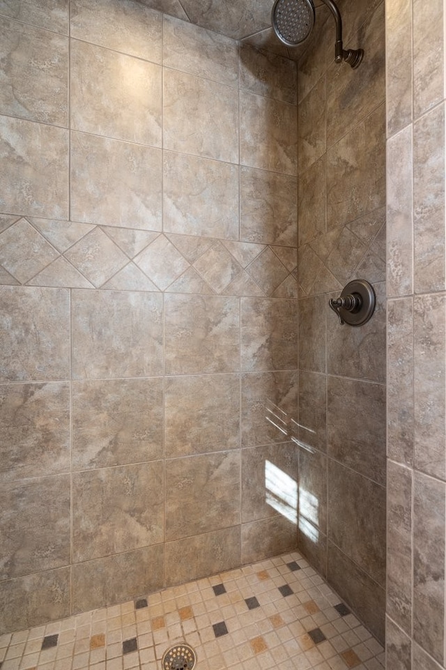 bathroom with a tile shower