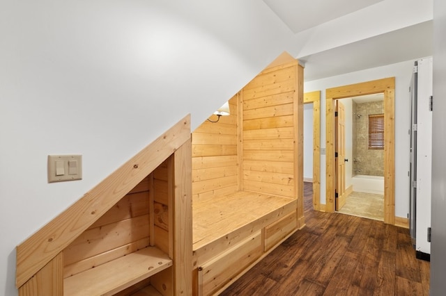 interior space with dark hardwood / wood-style floors and vaulted ceiling