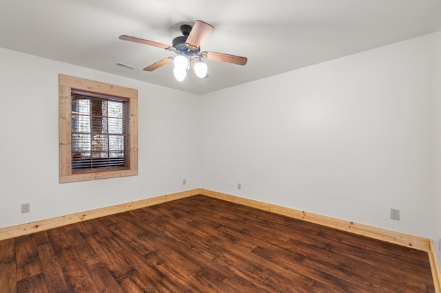 spare room featuring wood-type flooring and ceiling fan