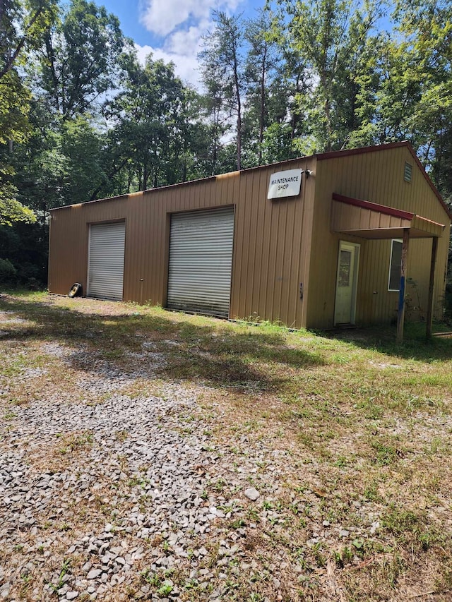 garage featuring a carport