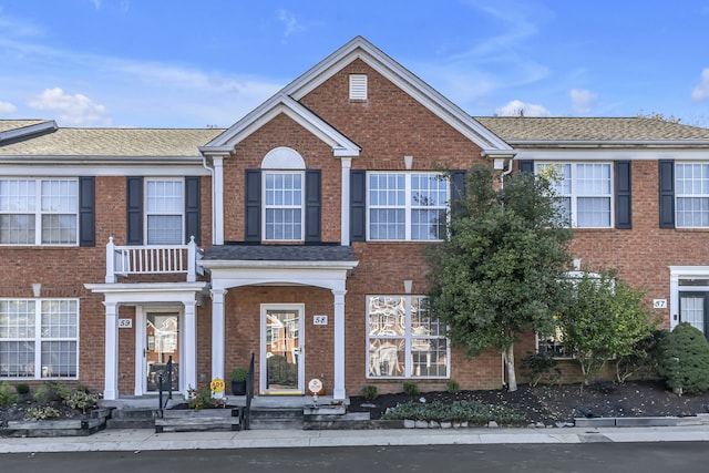 view of front of home with a balcony