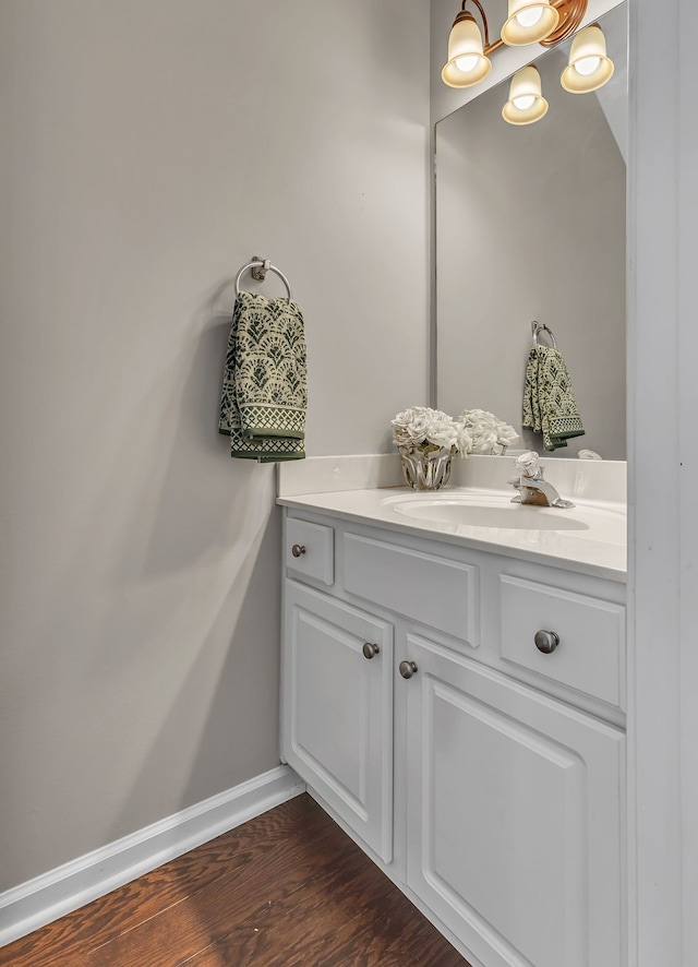 bathroom with vanity and wood-type flooring