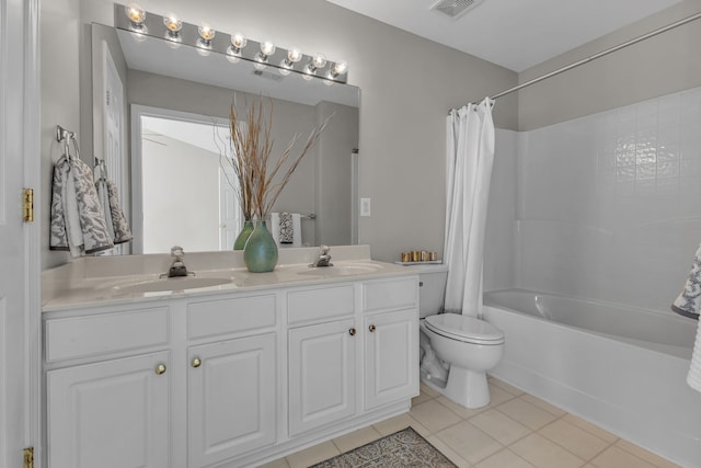 full bathroom with toilet, shower / bath combo, vanity, and tile patterned floors