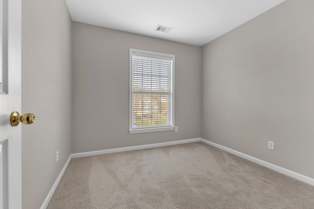 empty room featuring light colored carpet