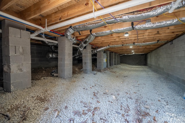 basement featuring water heater and crawl space