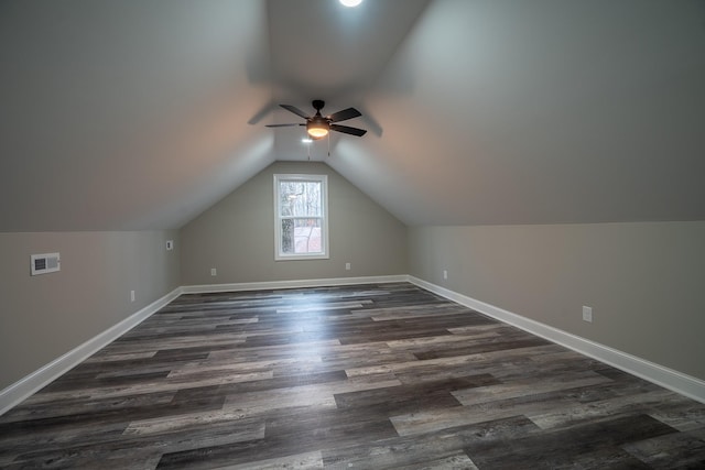 bonus room with visible vents, dark wood finished floors, baseboards, lofted ceiling, and ceiling fan