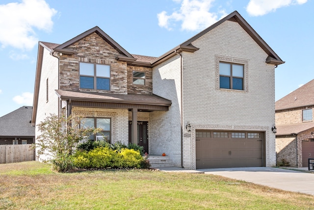 view of front facade with a front yard and a garage