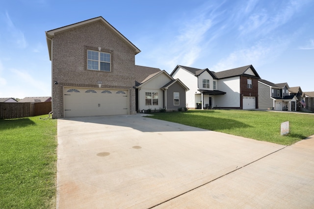 view of front of house with a front yard and a garage