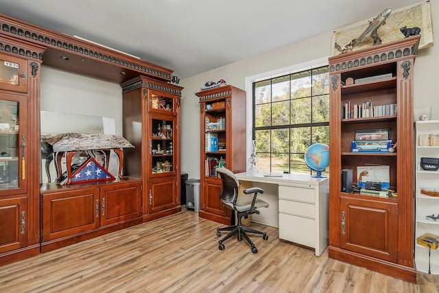 home office with light wood-style floors