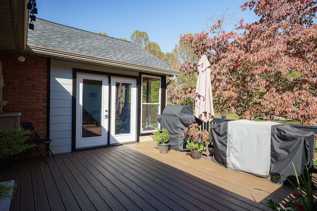 wooden deck featuring french doors and area for grilling