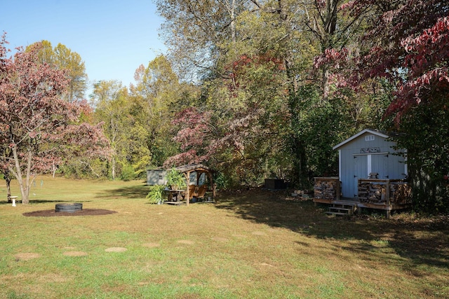 view of yard featuring an outbuilding and a deck