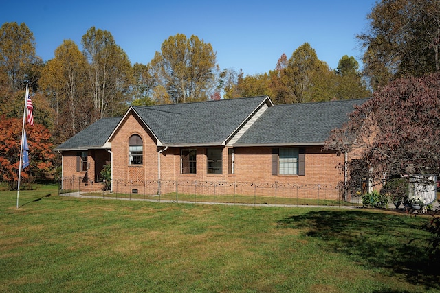 single story home featuring a front lawn