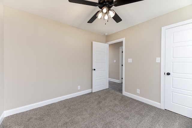 unfurnished bedroom featuring ceiling fan and carpet floors