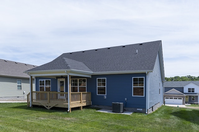 back of house with a wooden deck, a yard, central AC unit, and ceiling fan