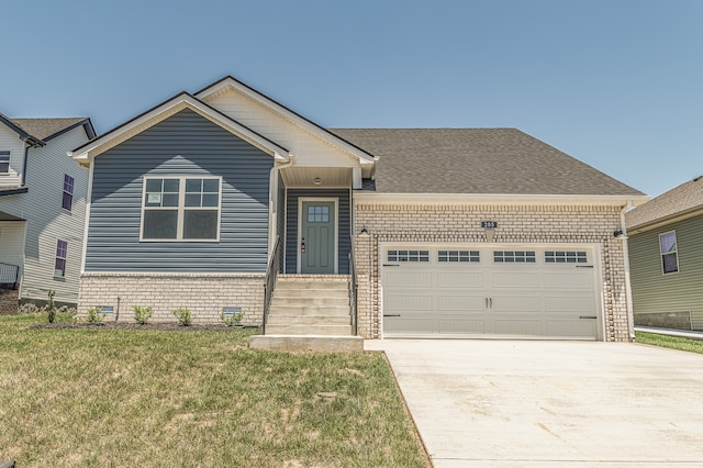 view of front of property featuring a shingled roof, concrete driveway, a front yard, an attached garage, and brick siding