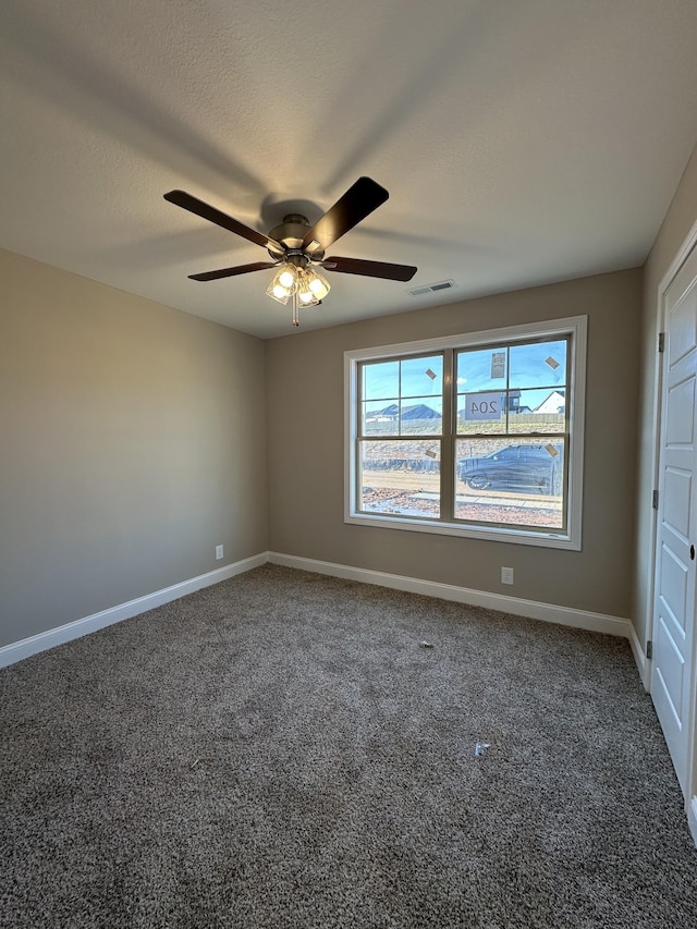 unfurnished bedroom with ceiling fan and carpet