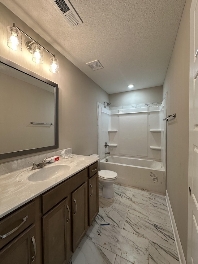 full bathroom with vanity, shower / washtub combination, toilet, and a textured ceiling