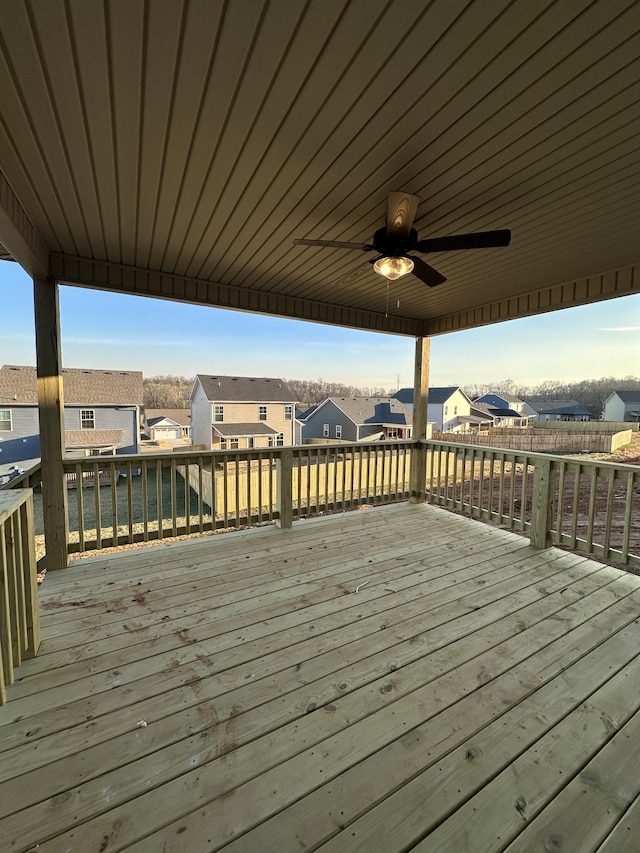 wooden terrace featuring ceiling fan