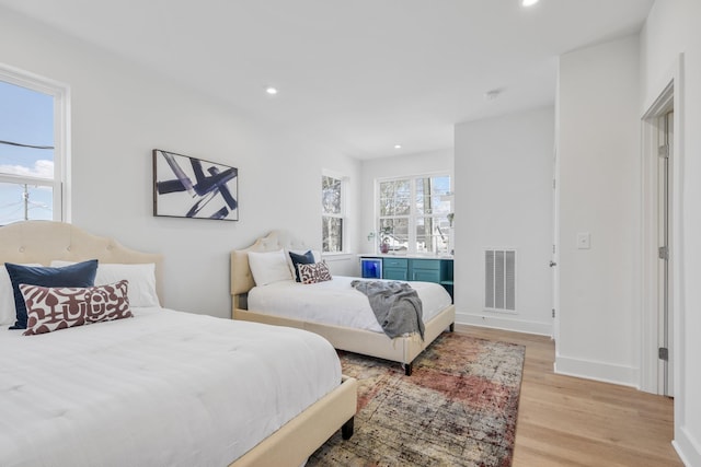 bedroom with light hardwood / wood-style floors