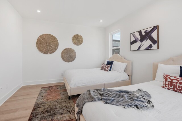 bedroom featuring wood-type flooring