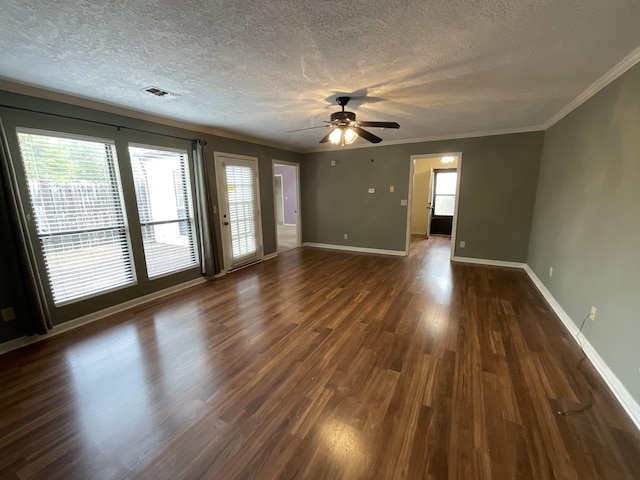 empty room featuring crown molding, ceiling fan, dark hardwood / wood-style flooring, and a textured ceiling