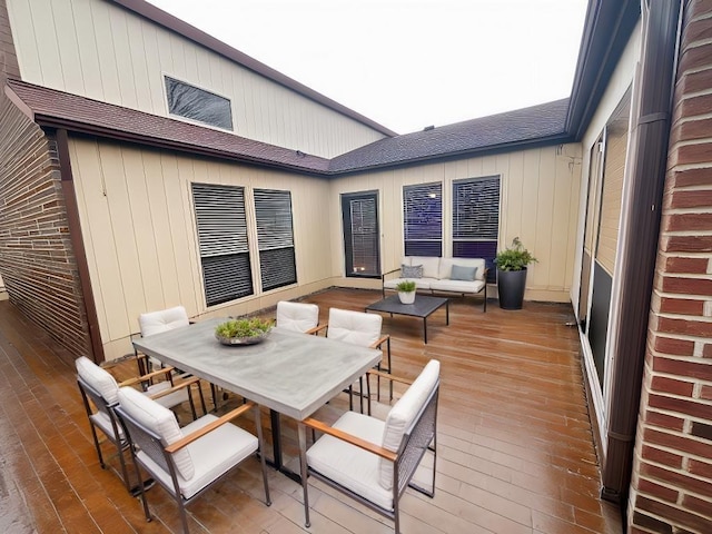 wooden deck with an outdoor hangout area