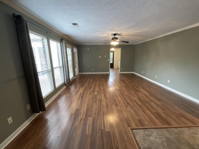 unfurnished room with ceiling fan, crown molding, dark hardwood / wood-style floors, and a textured ceiling