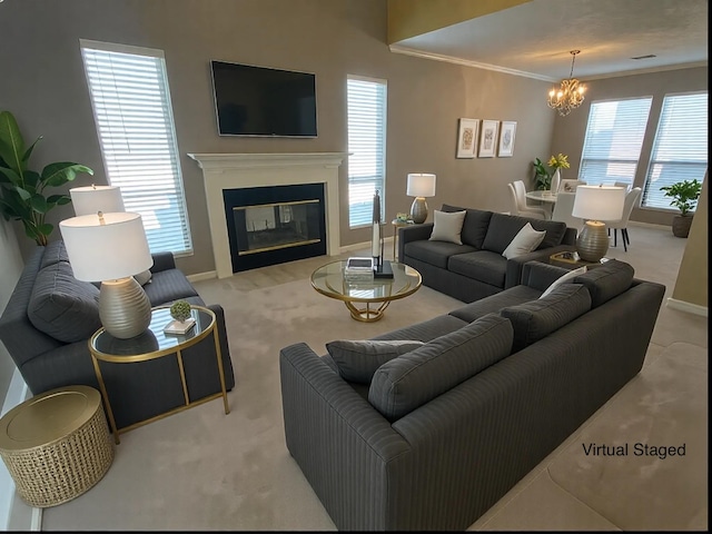 carpeted living room with crown molding, a healthy amount of sunlight, and a notable chandelier