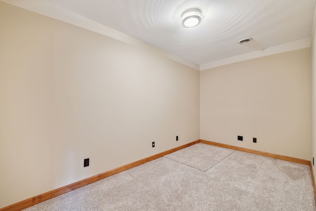 empty room with crown molding and light carpet