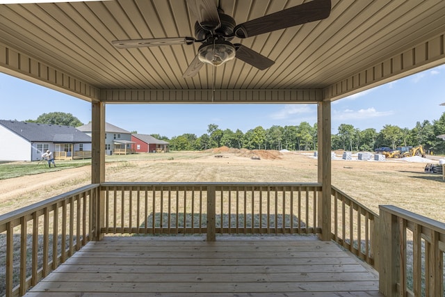 wooden deck featuring ceiling fan